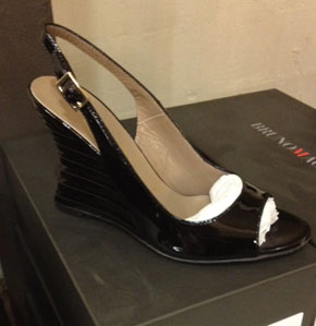 Kassidy Nero in Black, an interesting patent leather wedge with a peep toe ($159, orig. $340)